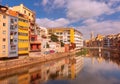 Colorful houses on the Onyar river with reflection in the water on a summer sunny day. The sights of Girona are cities in Cataloni Royalty Free Stock Photo