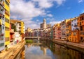 Colorful houses on the Onyar river with reflection in the water on a summer sunny day. The sights of Girona are cities in Cataloni Royalty Free Stock Photo