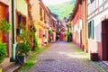 Colorful houses in picturesque street, Kaysersberg, Alsace, France Royalty Free Stock Photo