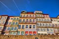 Colorful houses of Porto Ribeira, traditional facades, old multi-colored buildings with red roof tiles on the embankment in the Royalty Free Stock Photo