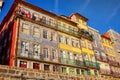 Colorful houses of Porto Ribeira, traditional facades, old multi-colored buildings with red roof tiles on the embankment in the Royalty Free Stock Photo