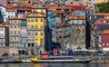 Colorful houses of Porto Ribeira, traditional facades, old multi-colored houses with red roof tiles on the embankment in the city