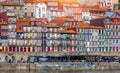 Colorful houses of Porto Ribeira, traditional facades, old multi-colored houses with red roof tiles on the embankment in the city