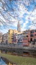 Colorful houses reflected in the Onyar river, in Girona, Catalonia, Spain. Church of Sant Feliu and Cathedral of Santa MarÃ Â­a in Royalty Free Stock Photo