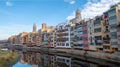 Colorful houses reflected in the Onyar river, in Girona, Catalonia, Spain. Church of Sant Feliu and Cathedral of Santa MarÃ Â­a in Royalty Free Stock Photo