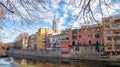Colorful houses reflected in the Onyar river, in Girona, Catalonia, Spain. Church of Sant Feliu and Cathedral of Santa MarÃ Â­a in Royalty Free Stock Photo