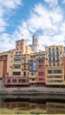 Colorful houses reflected in the Onyar river, in Girona, Catalonia, Spain. Church of Sant Feliu and Cathedral of Santa MarÃ Â­a in Royalty Free Stock Photo