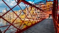 Colorful houses seen through the red iron bridge in Girona, Catalonia, Spain Royalty Free Stock Photo