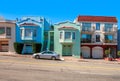 Colorful houses on sloping street in San Francisco. Royalty Free Stock Photo