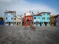 Colorful houses on a small traditional square at Burano island, Venice