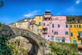 Colorful houses in a small village with stone bridge at Dolcedo, Imperia, Liguria, Italy Royalty Free Stock Photo