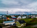 The colorful houses of StykkishÃÂ³lmur, Iceland with a sky full of coulds wide view