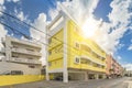 Colorful housing complex Rainbow House Ã¢â¦Â¢ in the vicinity of the American Village in Chatan City of Okinawa with yellow and