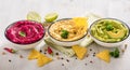 Colorful hummus, different dips, vegan snack, beetroot and avocado hummus, vegetarian eating