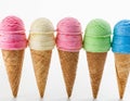 Colorful ice cream cones in a row on white background Royalty Free Stock Photo
