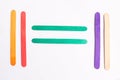 Colorful of Ice cream sticks with equals sign on white Royalty Free Stock Photo