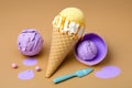 Colorful ice cream in waffle cone and scoop on brown background Royalty Free Stock Photo