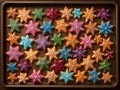 Colorful Iced Christmas Star Cookies on Baking Royalty Free Stock Photo