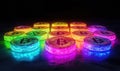 Colorful illuminated bitcoin coins arranged in a vibrant pattern on dark background