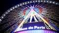 Colorful illuminated Rue de Paris observation wheel against night sky background Royalty Free Stock Photo