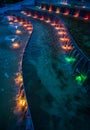 Colorful illuminated waterworks at evening