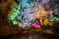 Colorful illumination in Dau Go cave in Halong Bay, Vietnam Royalty Free Stock Photo