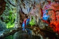 Colorful illumination in Dau Go cave in Halong Bay, Vietnam Royalty Free Stock Photo