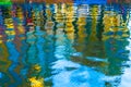 Colorful illustration of the buildings reflection along the canal in Amsterdam in the autumn