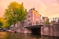 Amsterdam Sunset cityscape with canal, bridge and architecture