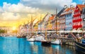 Boats and colorful buildings in Nyhavn Copenhagen Denmark at sunset. Royalty Free Stock Photo