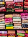 Colorful indian female cloths stack in wholesale shop