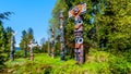 Colorful indigenous Totem Poles in Stanley Park in Royalty Free Stock Photo