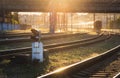 Colorful industrial landscape with railway platform, semaphore