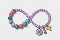 Colorful infinity necklace with beads and charms symbolizing eternity Royalty Free Stock Photo