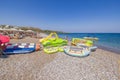 Colorful inflatable tubes on the beach, set to pull beach lovers into the sea for a fun water ride. Royalty Free Stock Photo