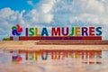 Colorful inscription Isla Mujeres on caribbean sea coast