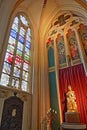 The colorful interior of the basilica of Saint Servatius, 11th century Cathedral, with a statue of Madonna and child