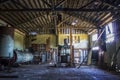 Colorful Interior of Crumbling Old Cannery Warehouse with Rusted Equipment