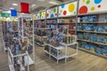 Colorful interior of Macy`s toy department. Rack with various boxes of toy models in front.