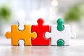 Colorful Interlocking Puzzle Pieces Representing Interoperability on Blurred Background. Generative AI Royalty Free Stock Photo