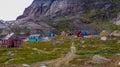 Colorful Inuit village at the foot of a cliff