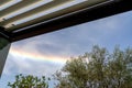 Beautiful Rainbow cloud over oliver trees. La Rochelle France Royalty Free Stock Photo