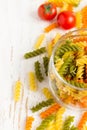 Colorful italian fusilli pasta in a jar, cherry tomatoes and spi Royalty Free Stock Photo