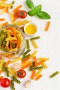 Colorful italian fusilli pasta in a jar, cherry tomatoes and spi Royalty Free Stock Photo