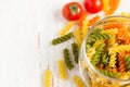 Colorful italian fusilli pasta in a jar, selective focus, space Royalty Free Stock Photo