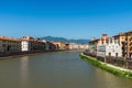 Colorful Italian houses in Pisa, Italy, alongside the embankment of Arno river. Royalty Free Stock Photo