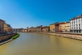 Colorful Italian houses in Pisa, Italy, alongside the embankment of Arno river. Royalty Free Stock Photo