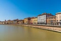 Colorful Italian houses in Pisa, Italy, alongside the embankment of Arno river. Royalty Free Stock Photo