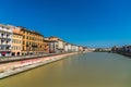 Colorful Italian houses in Pisa, Italy, alongside the embankment of Arno river. Royalty Free Stock Photo