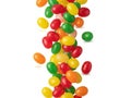 Colorful jelly beans falling in a vertical stream against a white background Royalty Free Stock Photo